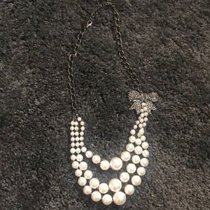 Faux pearl 3-strand necklace with bow detail